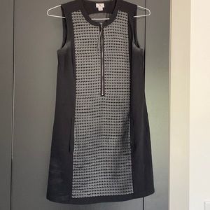 Black shift dress with faux leather detailing and pockets